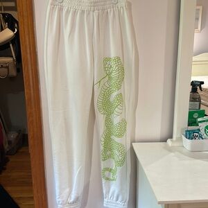 adika white sweatpants with lime green snake
